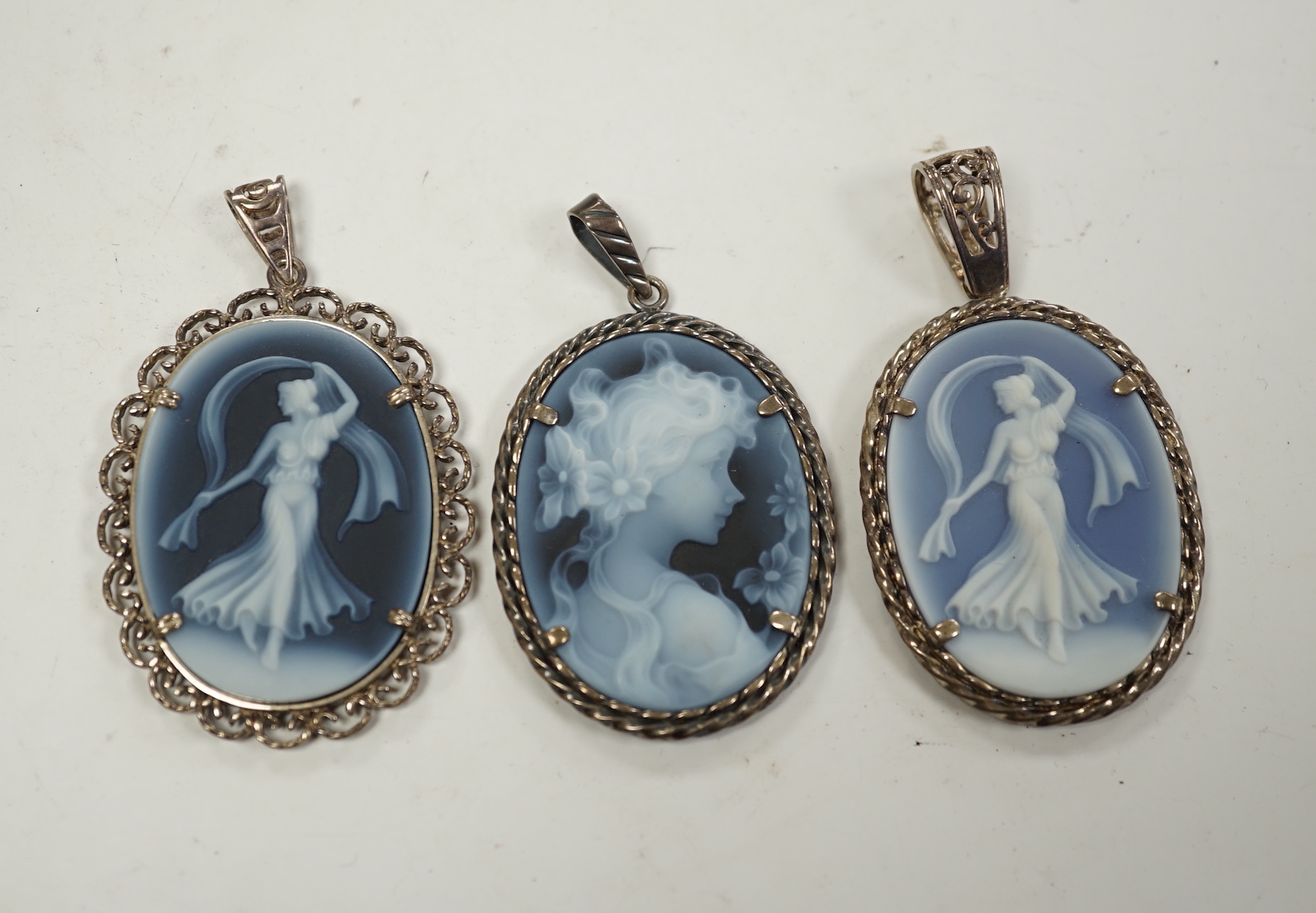 Three modern 925 or silver mounted Wedgwood style oval plaque pendants, 42mm.